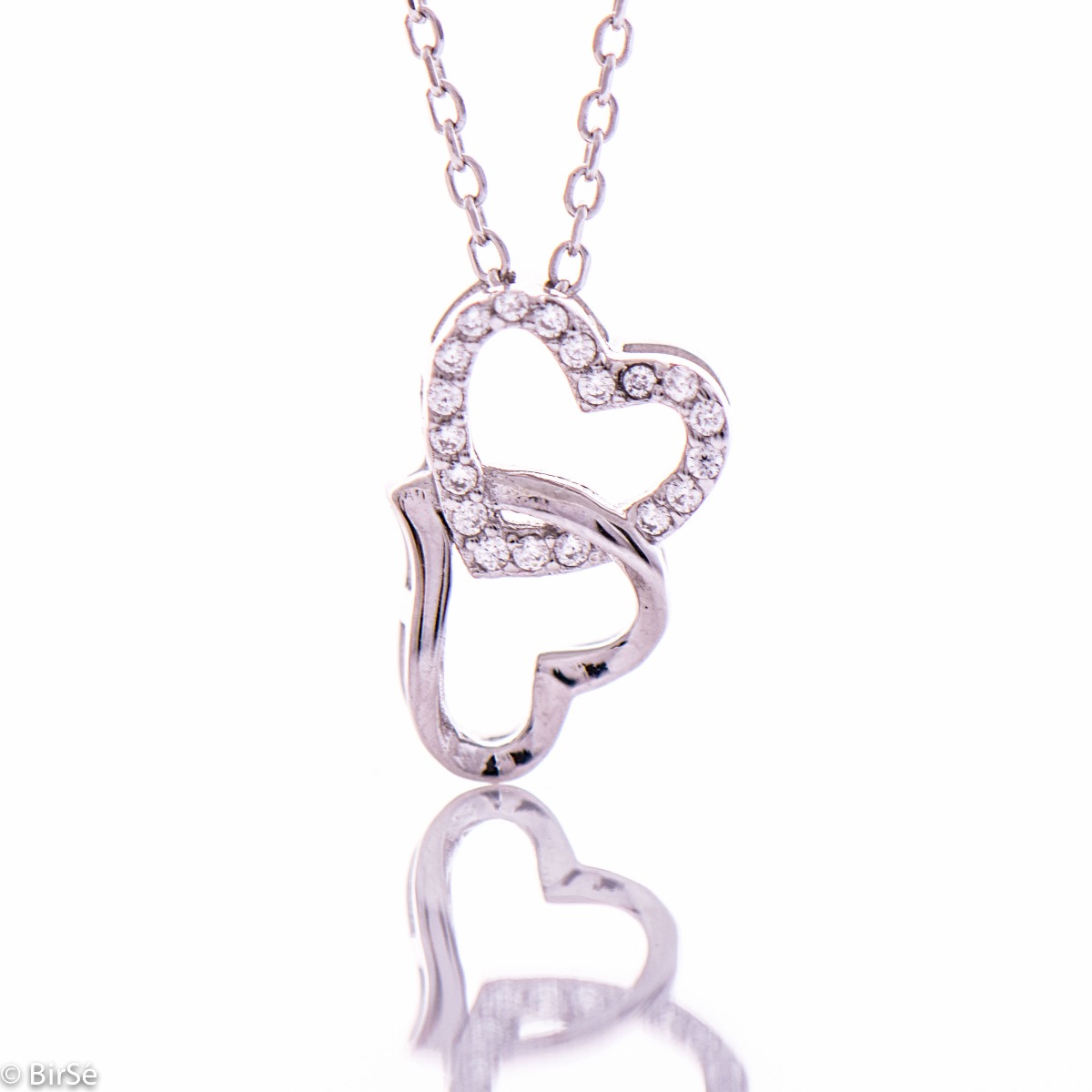 Rhodium silver necklace in the shape of two intertwined hearts. A stylish addition to your everyday look.