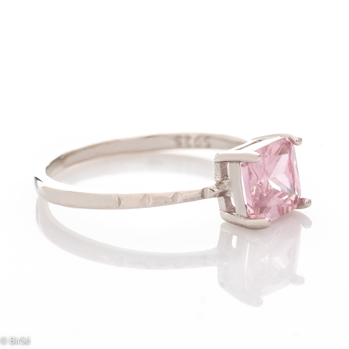 Delicately elegant women's ring with exquisite pink zircon. Stylish layout of the details and shapes from fine rhodium silver.