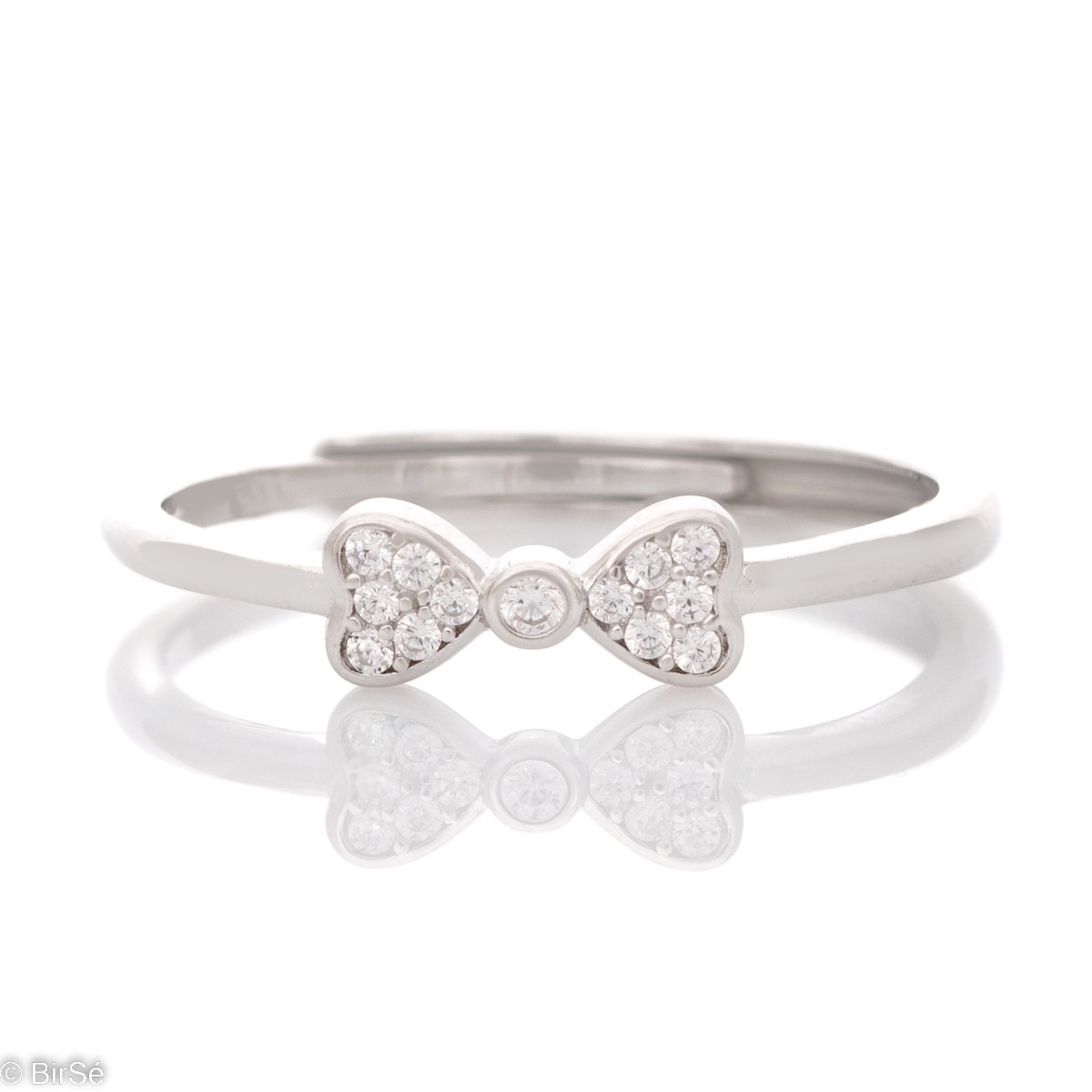 Delicately elegant silver ring with the shape of an exquisite ribbon. Stylish workmanship of the compositional elements and details of a fine overflow of rhodium silver with the sparkle of zircons. It is suitable for combining with silver earrings and pen