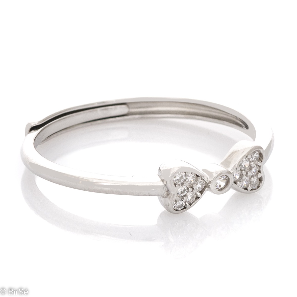 Delicately elegant silver ring with the shape of an exquisite ribbon. Stylish workmanship of the compositional elements and details of a fine overflow of rhodium silver with the sparkle of zircons. It is suitable for combining with silver earrings and pen