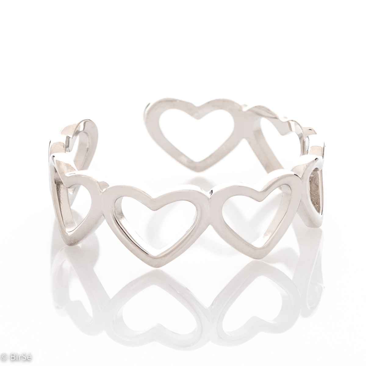 A charming ring, made entirely of soft rhodium-plated silver. A row of dainty hearts form the ring, which is open type and allows for partial size adjustment.