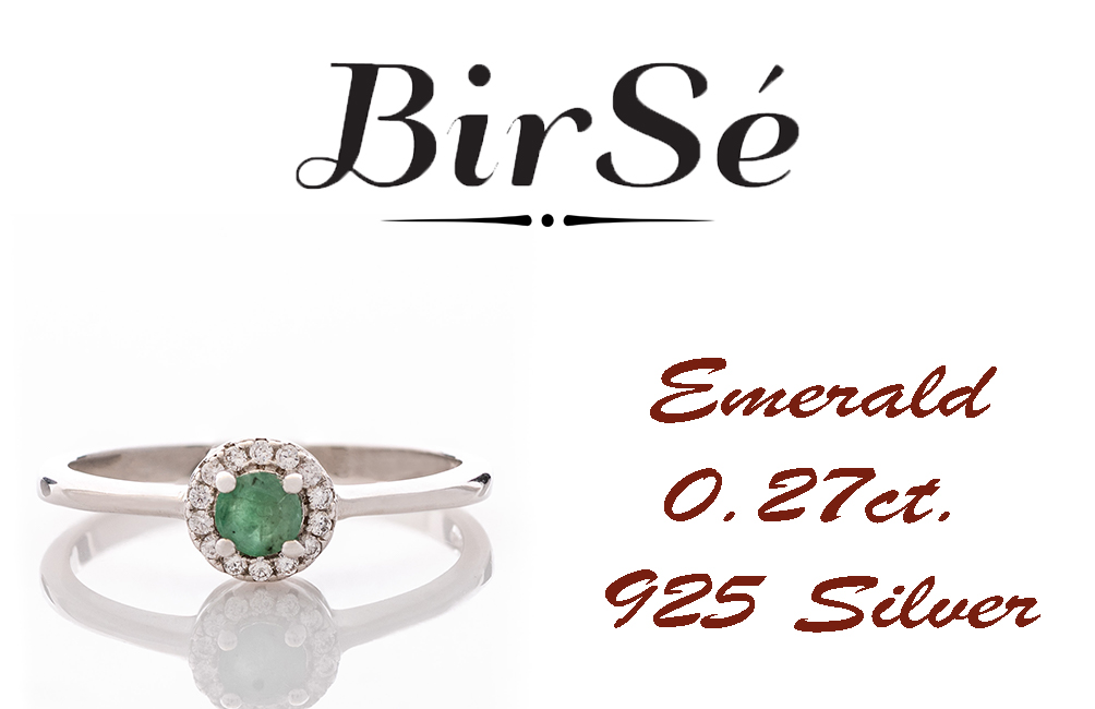 Delicate emerald shine - an extremely beautiful ladies ring with a round shape. Stylish craftsmanship from a fine combination of rhodium silver, fine emerald and sparkling zircons.