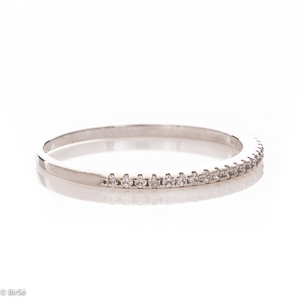 Elegant ring - a ring with a spectacular look and charming design. Stylish craftsmanship from a fine combination of rhodium-plated silver with sparkling zircons. It is suitable to combine with other delicate silver rings with or without zircons.