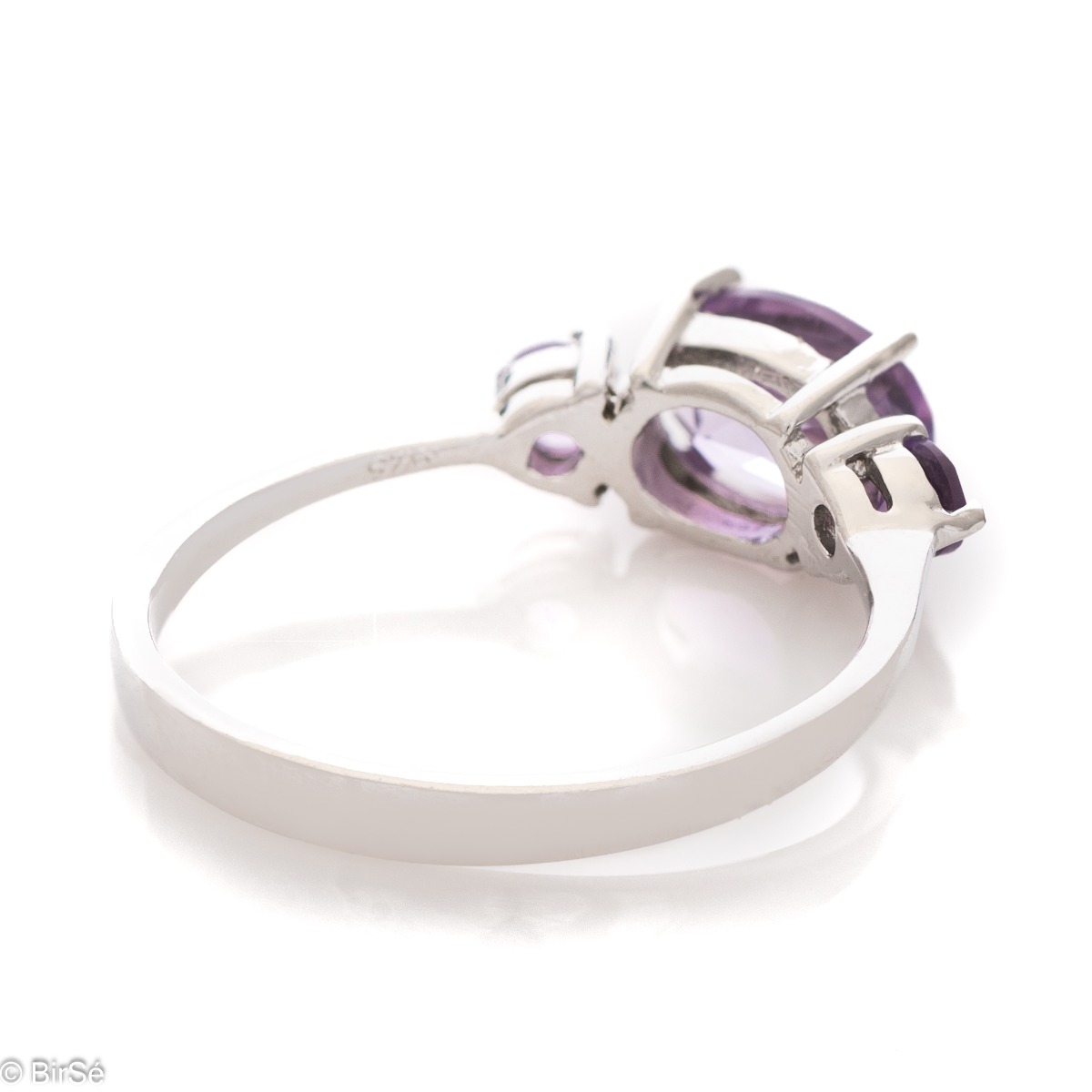 A stylish new offering for your jewelry collection. A ladies' ring made entirely of fine rhodium silver that gently envelops a magnetic amethyst.