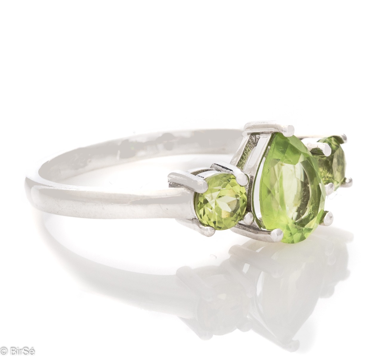 A delicate ring, finely crafted from rhodium-plated silver and a soft green teardrop-shaped peridot stone. Beautiful jewelry for stylish ladies.