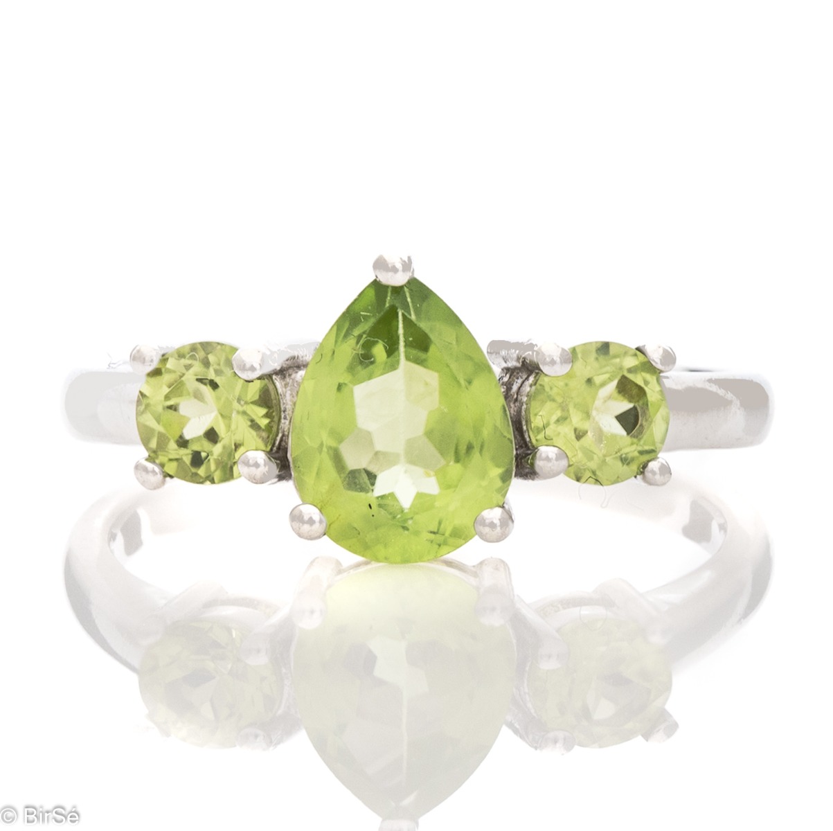 A delicate ring, finely crafted from rhodium-plated silver and a soft green teardrop-shaped peridot stone. Beautiful jewelry for stylish ladies.