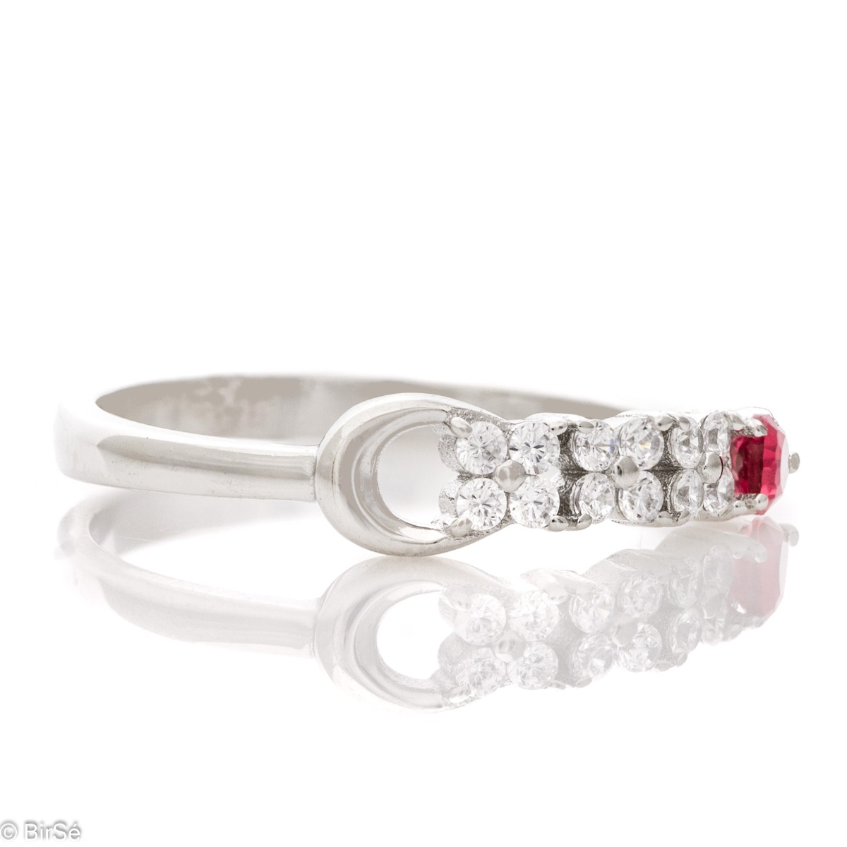 Elegant women's ring with exquisite rhodium-plated silver and radiant ruby ​​drop, in the company of sparkling zircons.