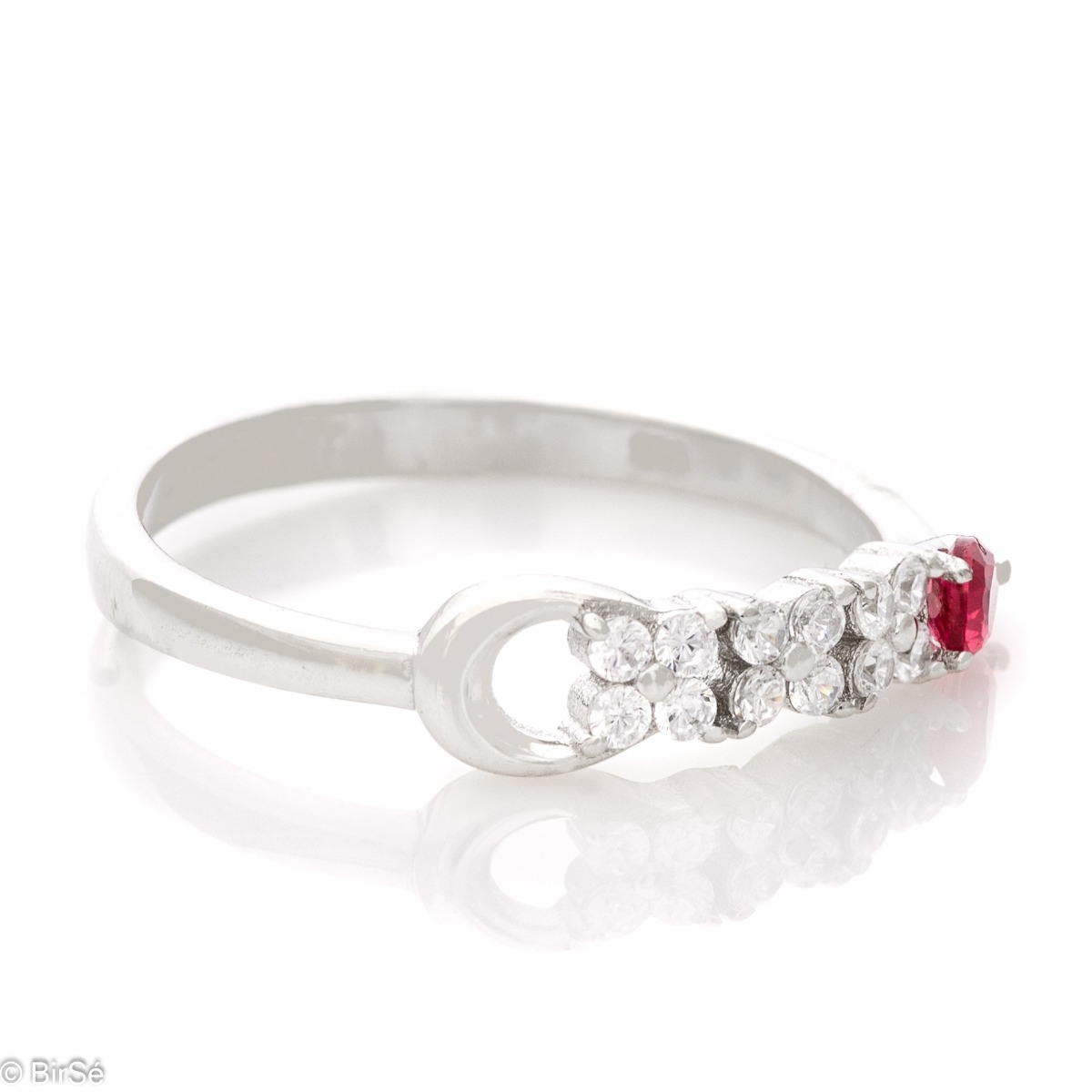 Elegant women's ring with exquisite rhodium-plated silver and radiant ruby ​​drop, in the company of sparkling zircons.