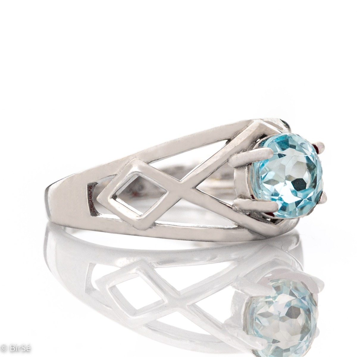 Delightful rhodium silver and natural blue topaz ring. The seductive charm of the stone can captivate any stylish and sophisticated lady