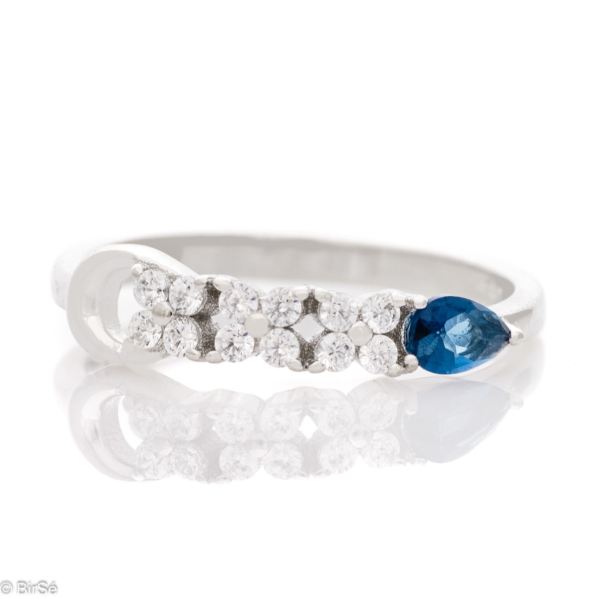 Elegant women's ring with exquisite rhodium-plated silver and radiant sapphire drop, in the company of sparkling zircons.