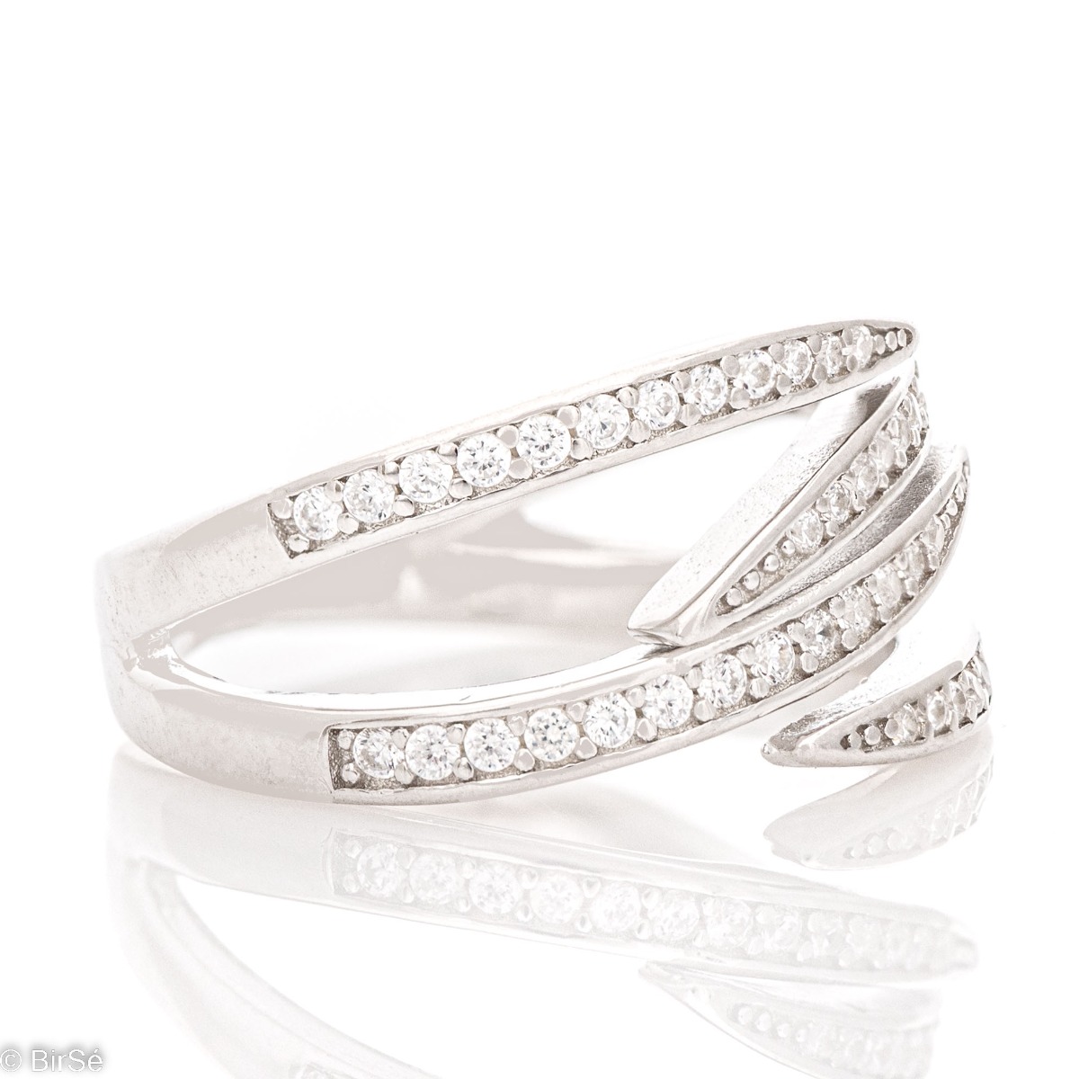 A unique silver ring with spectacular rhodium-plated silver elements. Sparkling zircons add extra shine and sophistication to the jewelry. The ring is suitable for ladies with a taste for lavish glamorous jewelry.