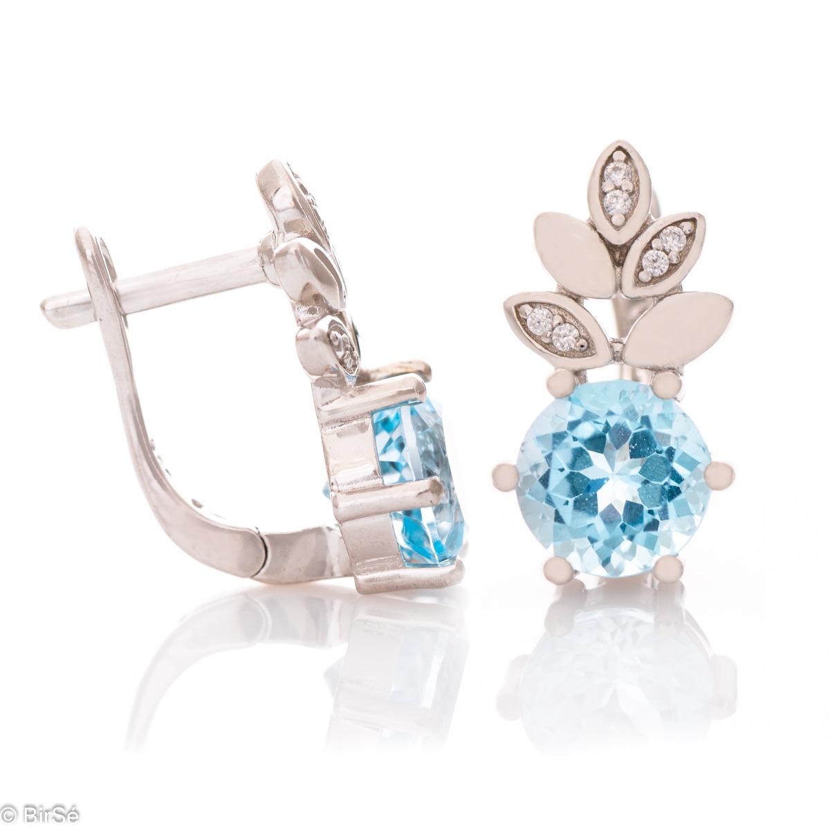 Charming earrings with exquisite design in pineapple shape carefully crafted from rhodium silver, sparkling blue topaz and fine cubic zirconias. Part of a delightful set that includes a ring and delicate pendant with the same lovely design. The effect of 