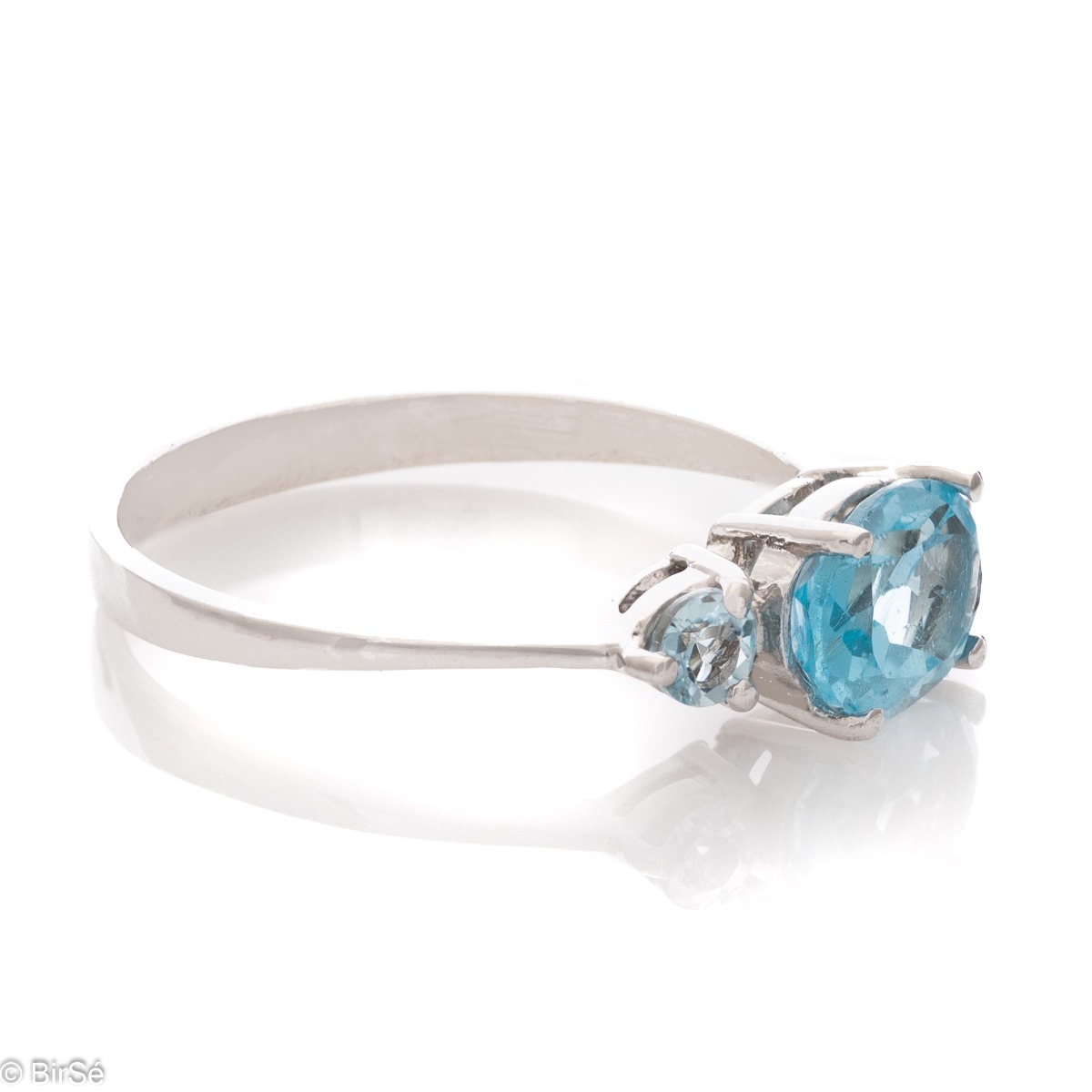 A stylish new offering for your jewelry collection. A ladies ring made entirely of fine rhodium silver that gently envelops a dazzling blue topaz.