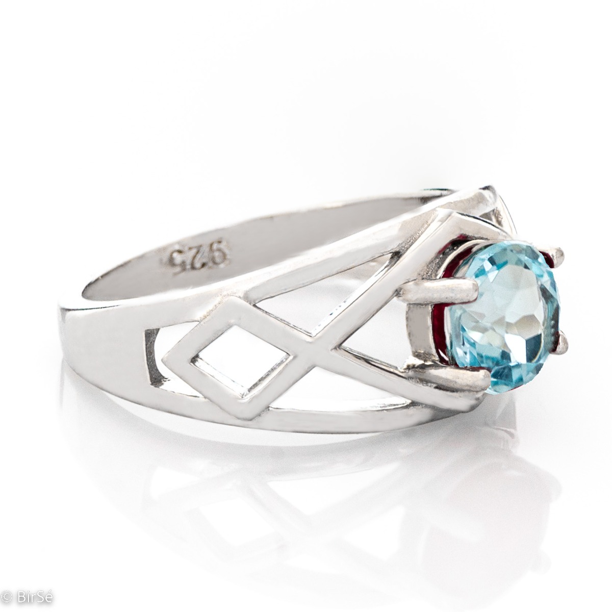 Delightful rhodium silver and natural blue topaz ring. The seductive charm of the stone can captivate any stylish and sophisticated lady