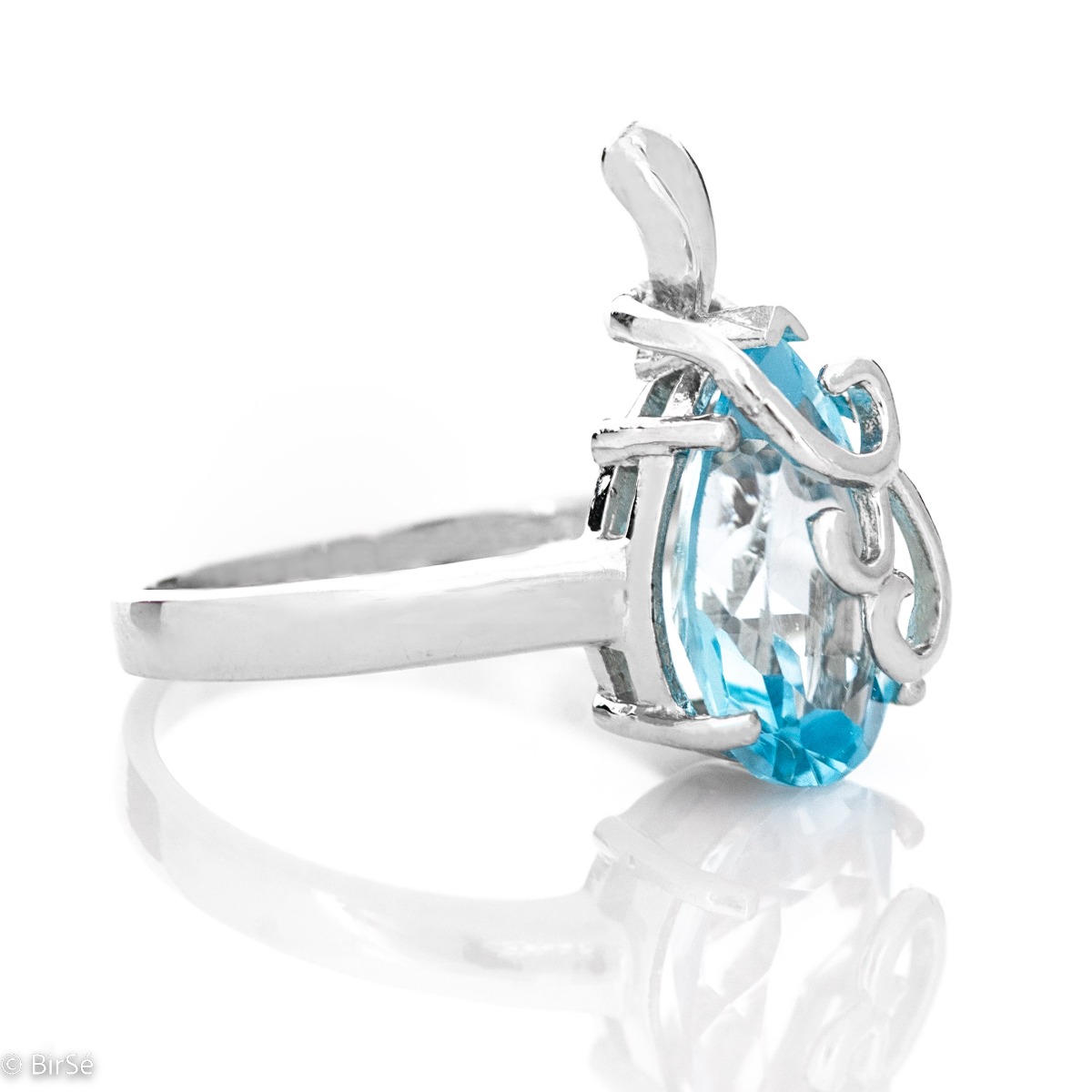 An elegant women's ring with a charming and radiant natural blue topaz in a delicate teardrop shape and precise craftsmanship combining fine curves and rhodium-plated silver. It can be combined with a pendant and earrings of the same model.