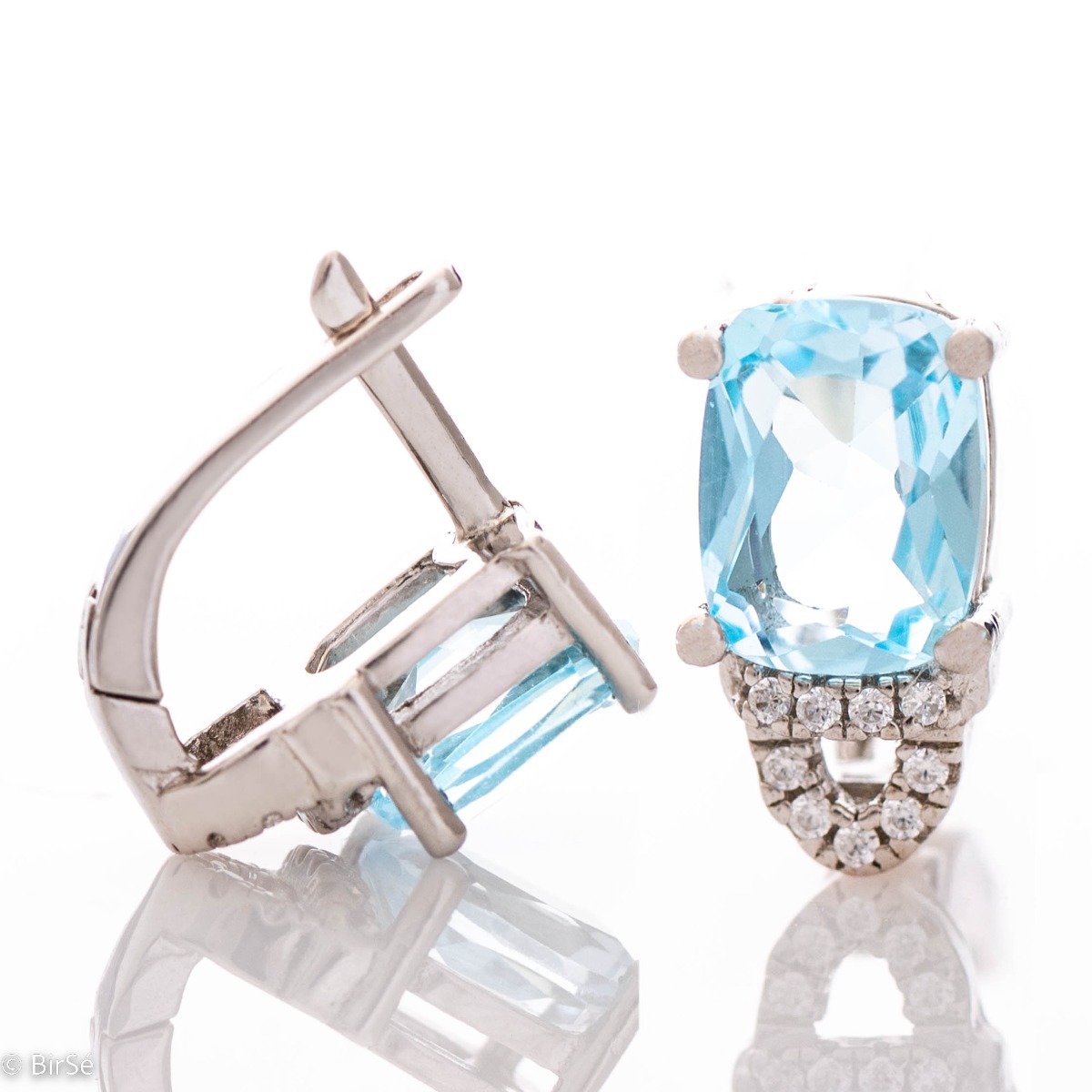 For the gallant ladies with elegant taste and style, our rhodium silver and natural blue topaz earrings will complement any outfit perfectly. You can match them with a ring from the same collection.