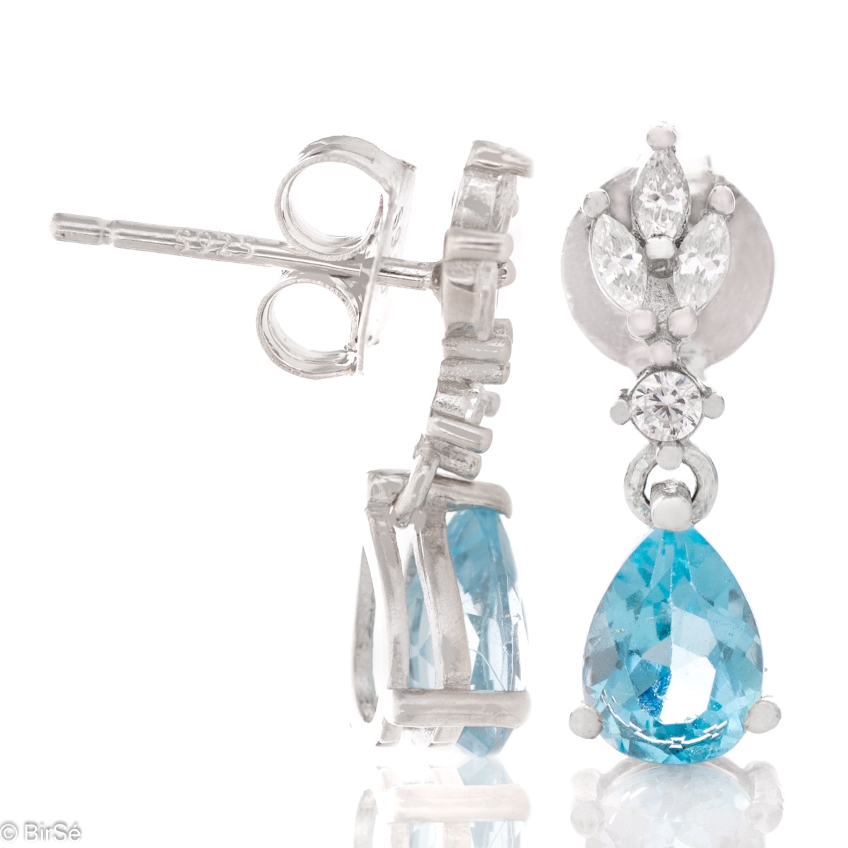 Add style to any outfit with the rhodium silver earrings and drops of natural blue topaz. The elegant design is embodied in a necklace and ring from the same collection.