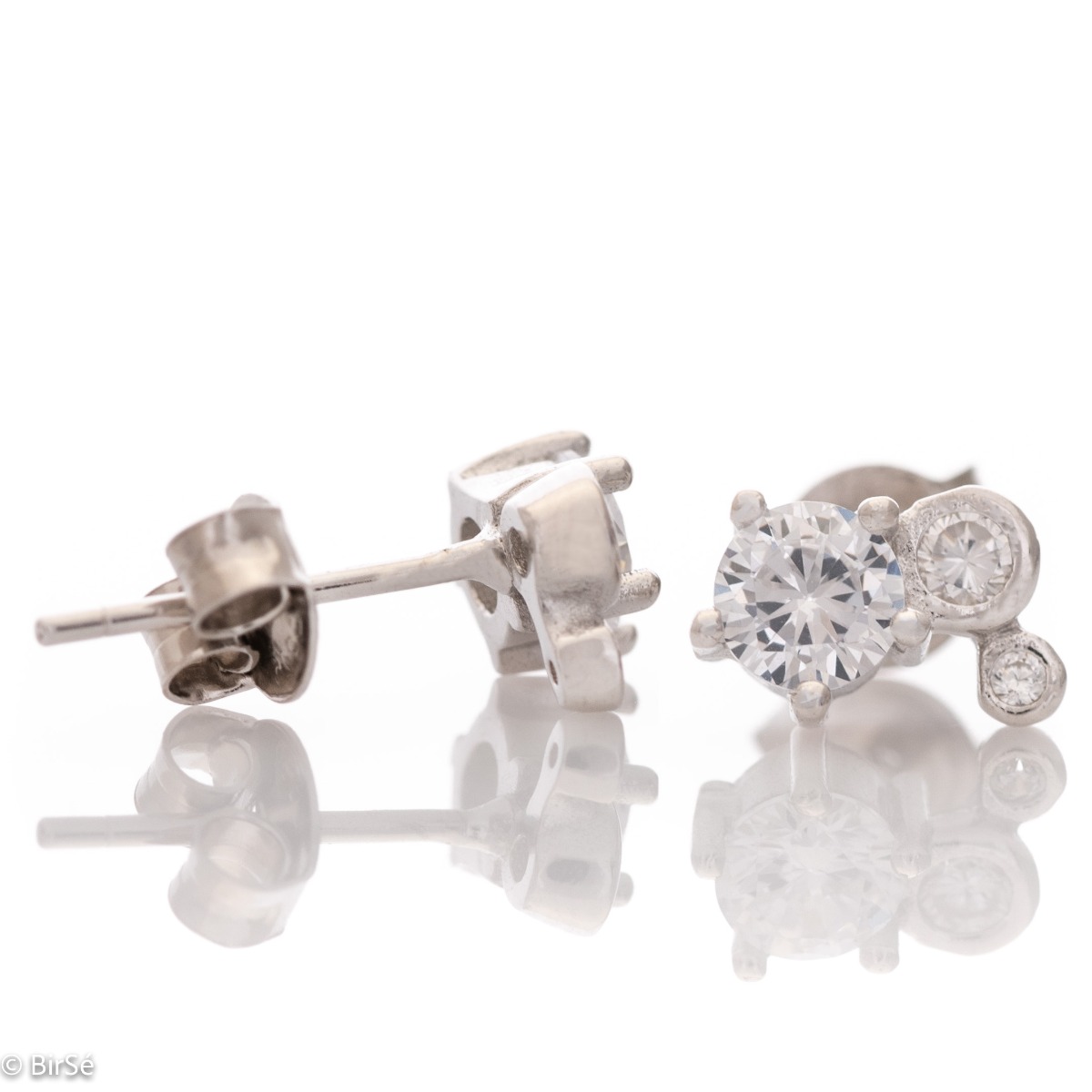 Charming women's earrings, masterfully crafted from fine rhodium silver with an elegant design. The elements are beautifully sculpted, the dazzling three zircons sparkle charmingly, and the pin fastening is comfortable and practical.