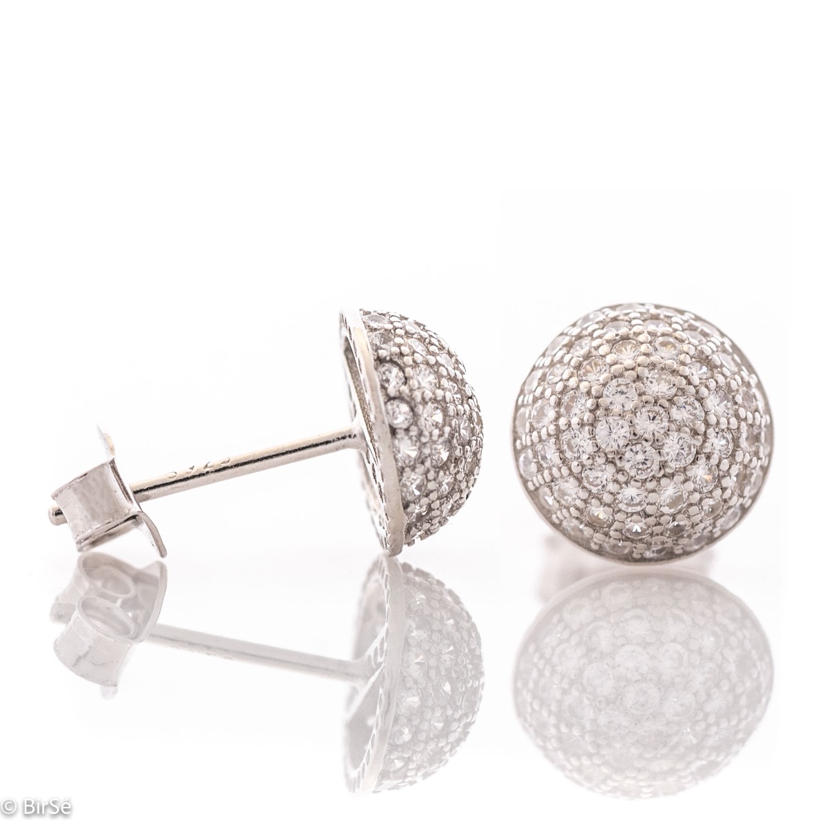 Charming women's earrings, masterfully crafted from fine rhodium silver with an elegant design. A beautifully sculpted hemisphere, dazzling zircons magically sparkle on silver, and the pin fastening is comfortable and practical.