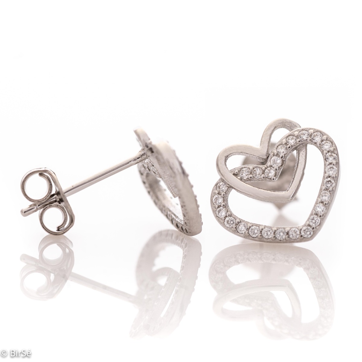 A charming model of women's earrings with an elegant design of intertwined hearts, completely formed by combining rhodium-plated silver with sparkling zircons. The fastening is with a pin - comfortable and practical. A beautiful look for your special mome