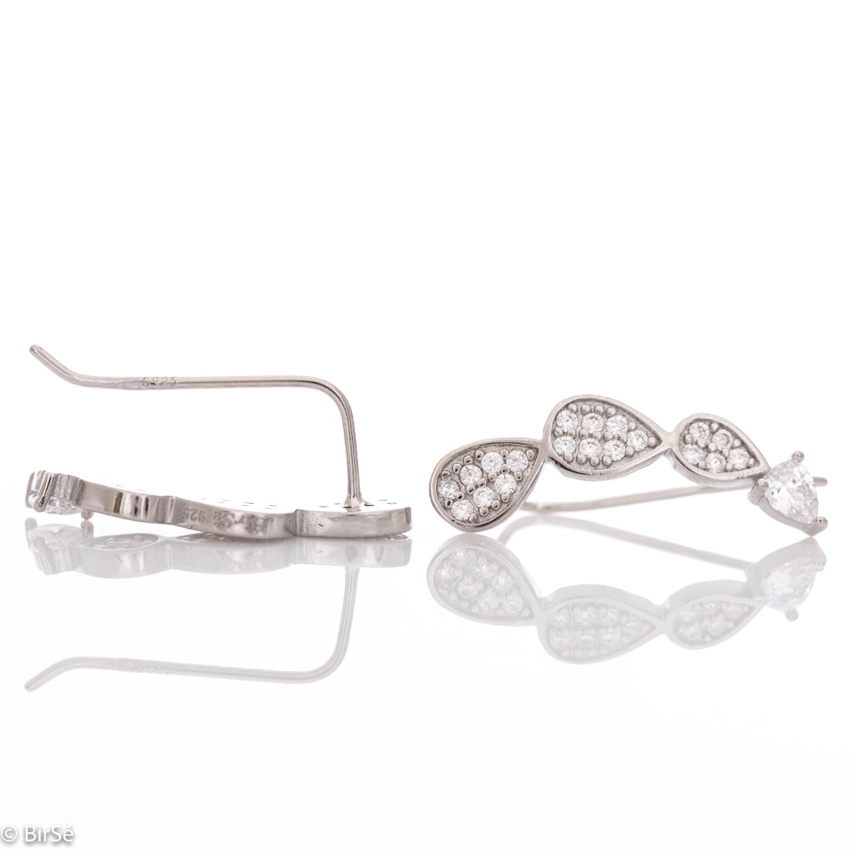 Exquisite hairpin earrings in fine rhodium-plated silver, with drop-shaped elements decorated with sparkling zircons.