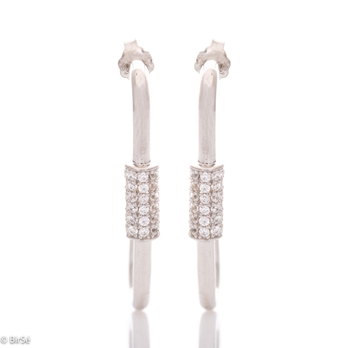 Extravagant earrings in fine rhodium silver with a modern design, decorated with an element of sparkling zircons. Pin fastening is for convenience and security.