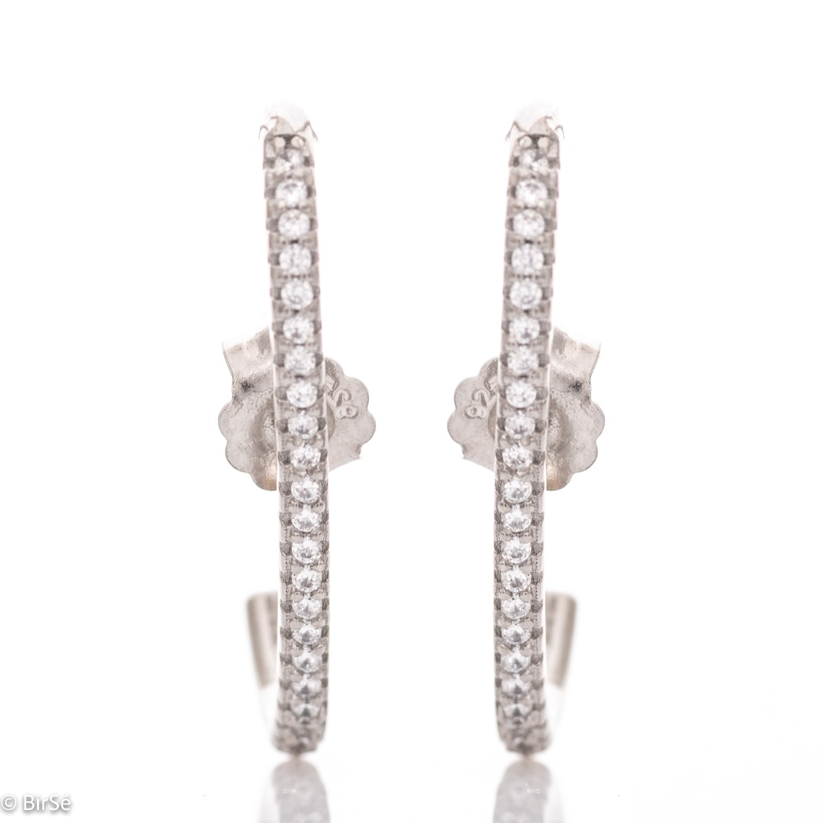 Non-standard earrings in fine rhodium silver with a modern design, decorated with sparkling zircons. Fastening with a pin - practical and comfortable.