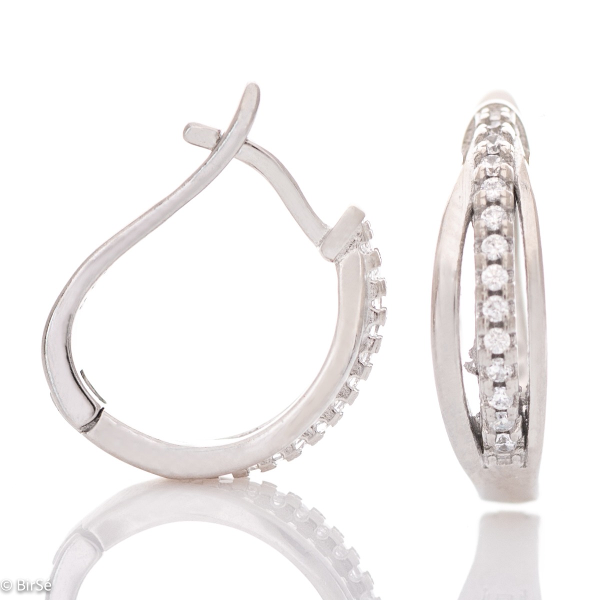 Elegant earrings with a stylish design, fine elements of rhodium-plated silver, decorated with sparkling zircons. The earrings have an English fastening - practical and secure.