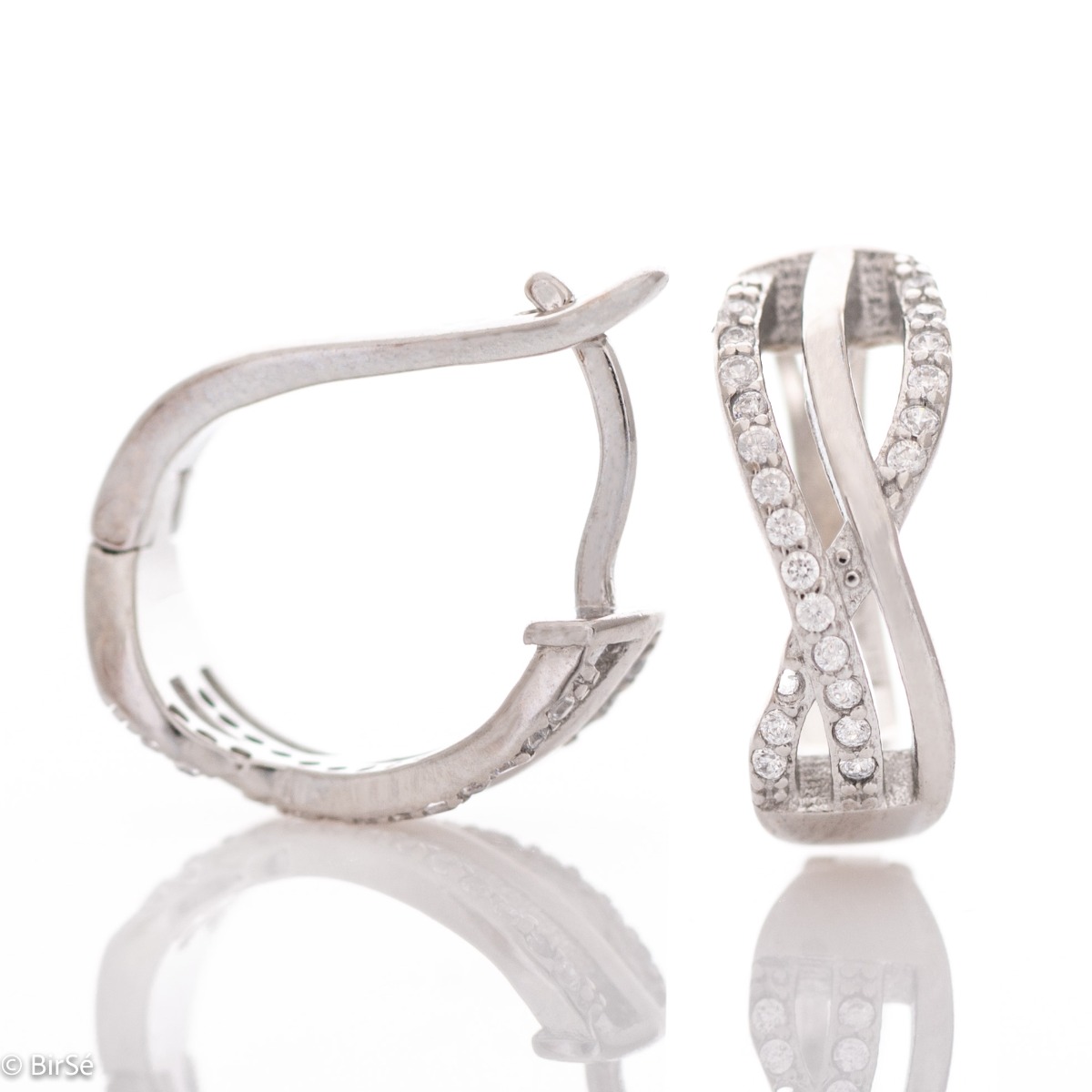 Elegant earrings with a stylish design, fine elements of rhodium-plated silver, decorated with sparkling zircons. The earrings have an English fastening - practical and secure.