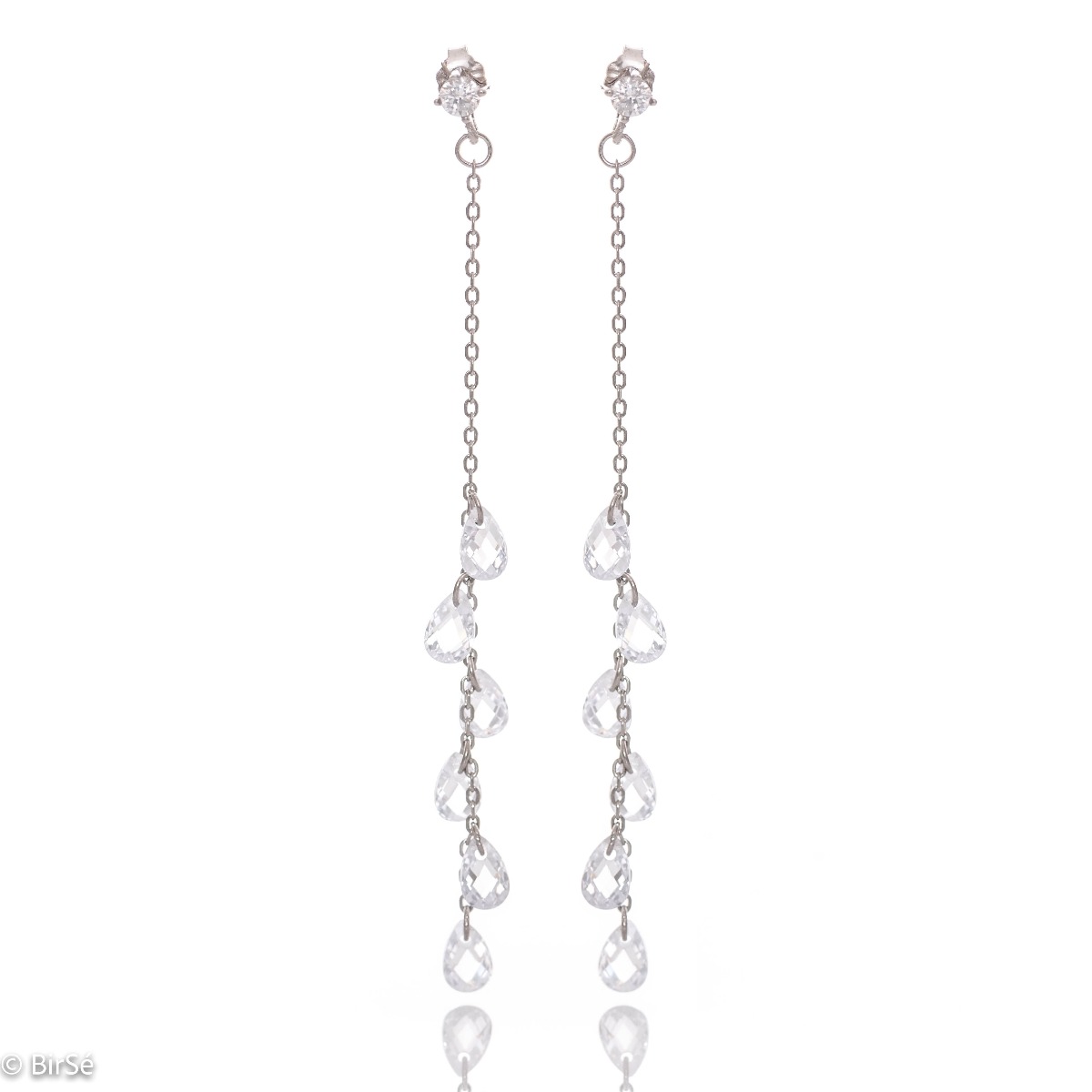 Charming dangling earrings in fine rhodium silver, with a delicate chain decorated with teardrop zircons. Pin fastening - comfortable and practical for ladies.