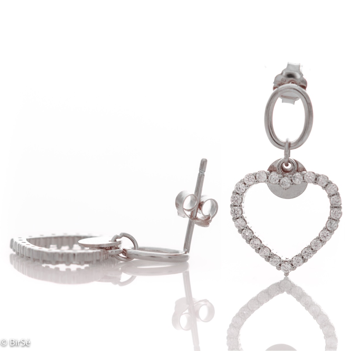 Captivating women's earrings in shiny rhodium silver with dangling hearts. Beautiful zircons add charm to the delicate jewelry. With pin fastening - preferred and comfortable for ladies.