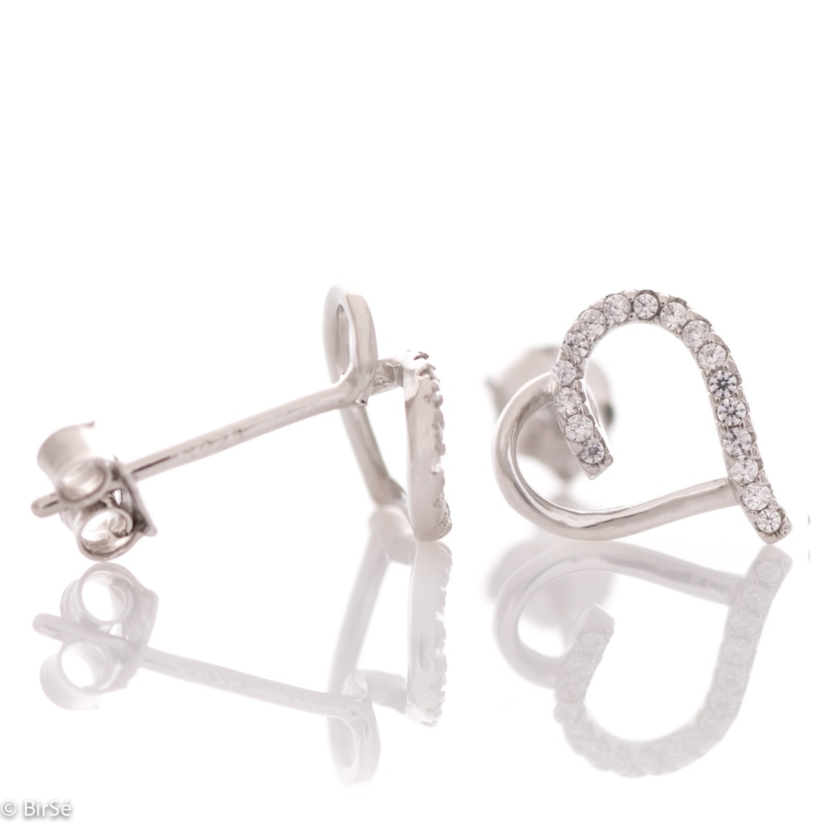 Stylish model of silver heart earrings with zircons. Beautiful stones add extra sparkle to the delicate piece of jewelry. With pin fastening - preferred and comfortable for ladies.