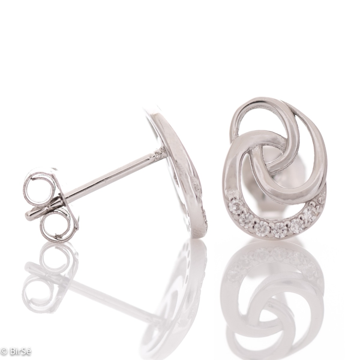 Charming silver rose earrings with dazzling zircons. Beautiful stones add extra sparkle to the delicate piece of jewelry. With pin fastening - preferred and comfortable for ladies.