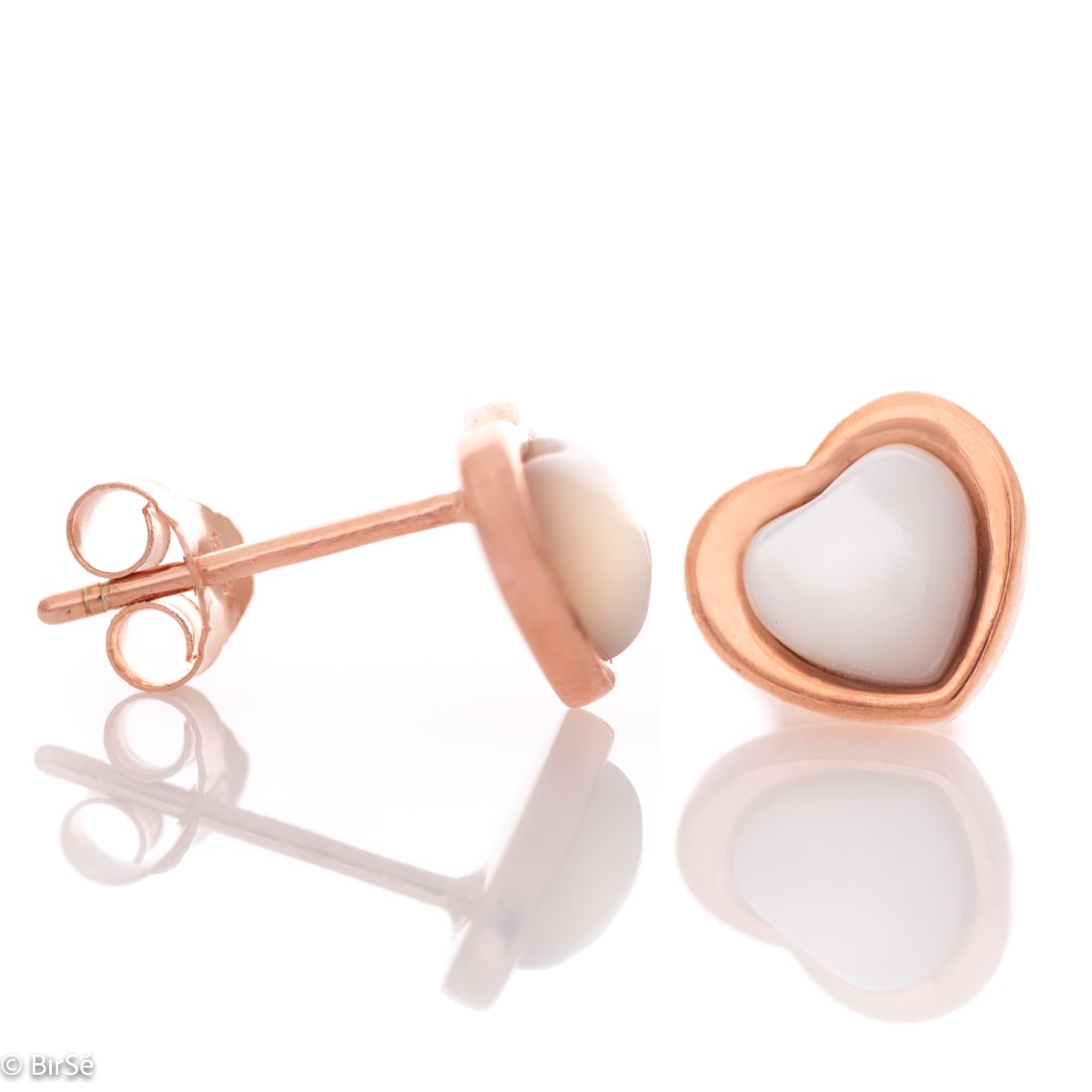 Elegant ladies' earrings made entirely of fine rose silver with a heart shape. Their core is shaped from a beautiful milky white stone, and the fastening is with a pin.