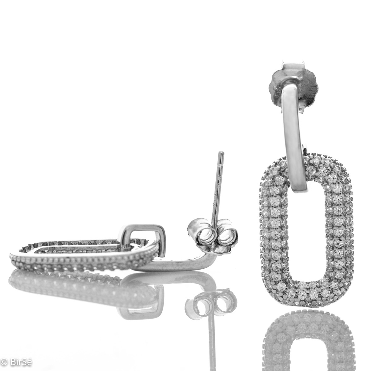 Charming women's earrings made entirely of fine rhodium silver with a dangling element elegantly decorated with fine zircons. The clasp is with a pin, and the earrings make a suitable gift for any occasion.