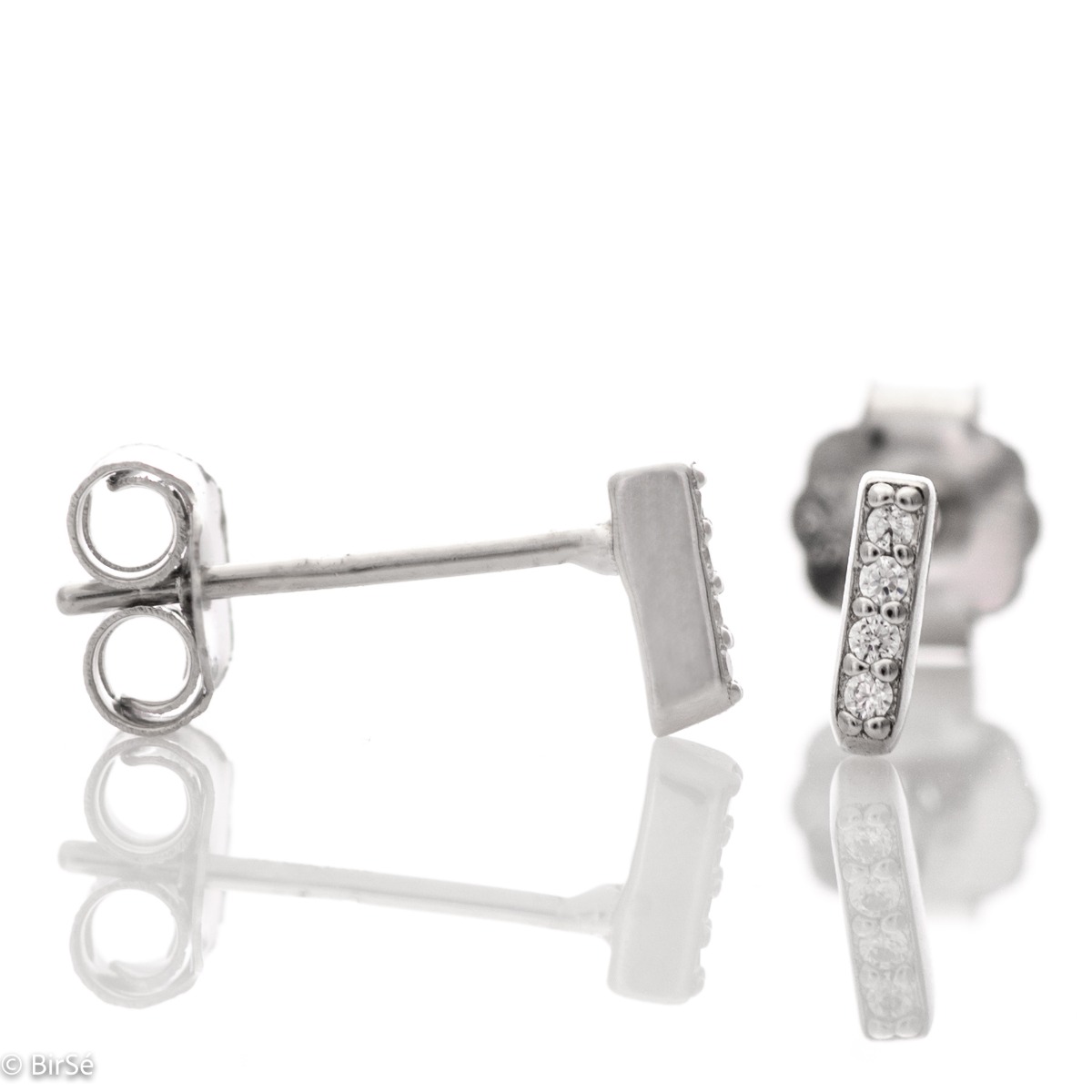 Simple earrings made with an elegant design of the elements of rhodium silver and sparkling zircons. The fastening is with a pin - secure and preferred by the ladies.