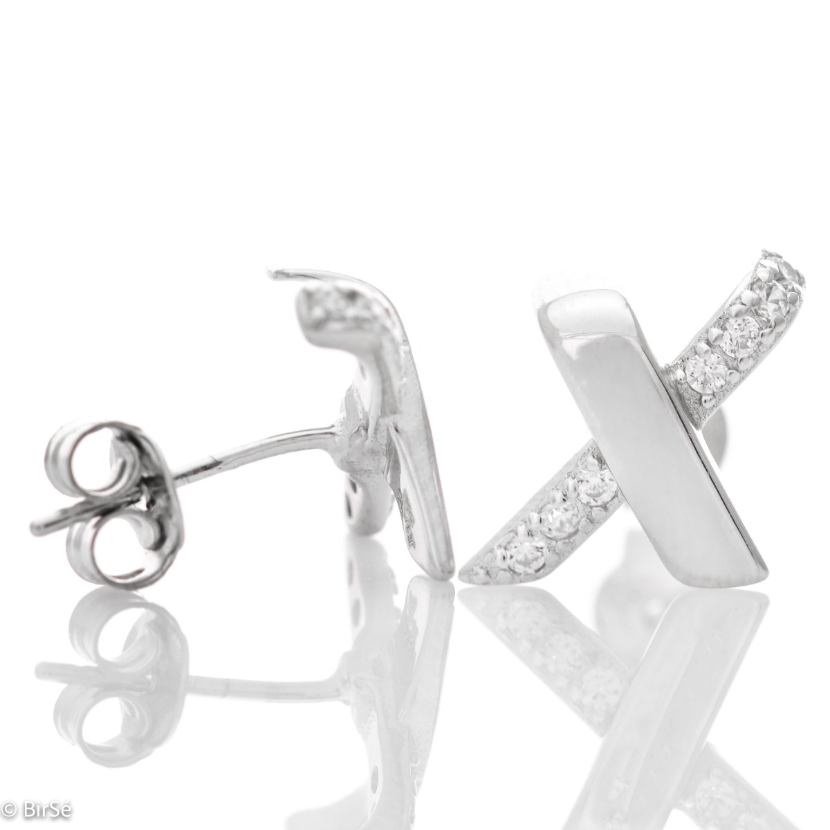 Stylish women's earrings with a modern design, made entirely of soft rhodium silver and shiny zircons, with a pin fastening that is convenient for your everyday life. A suitable gift for any occasion.