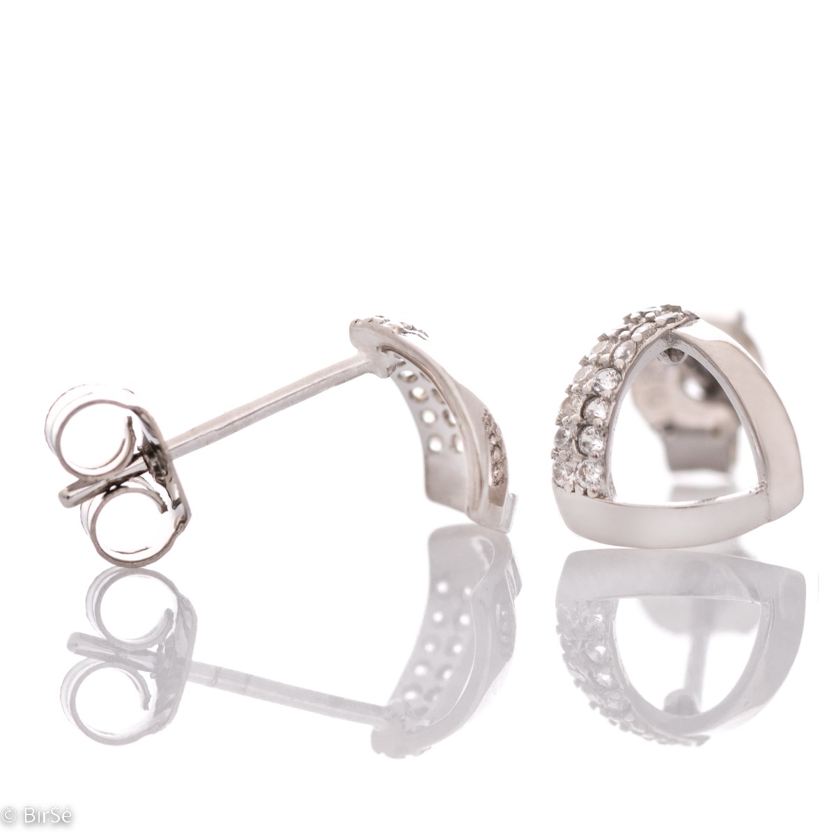 Charming earrings with a delicate design, made of rhodium-plated silver, combined with fine sparkling zircons. The pin fastening is secure and comfortable, and the earrings make a suitable gift for any lady.