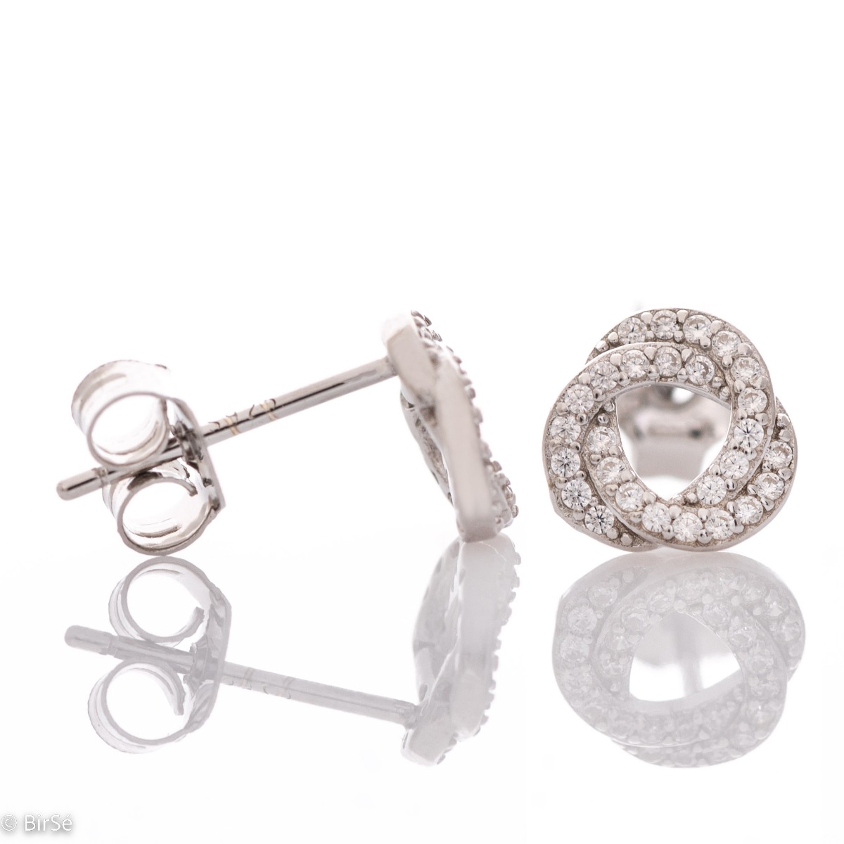 A lovely offering of earrings for your favorite jewelery collection. Elegantly crafted from fine rhodium silver in combination with sparkling delicate zircons. The earrings have a comfortable pin fastening.