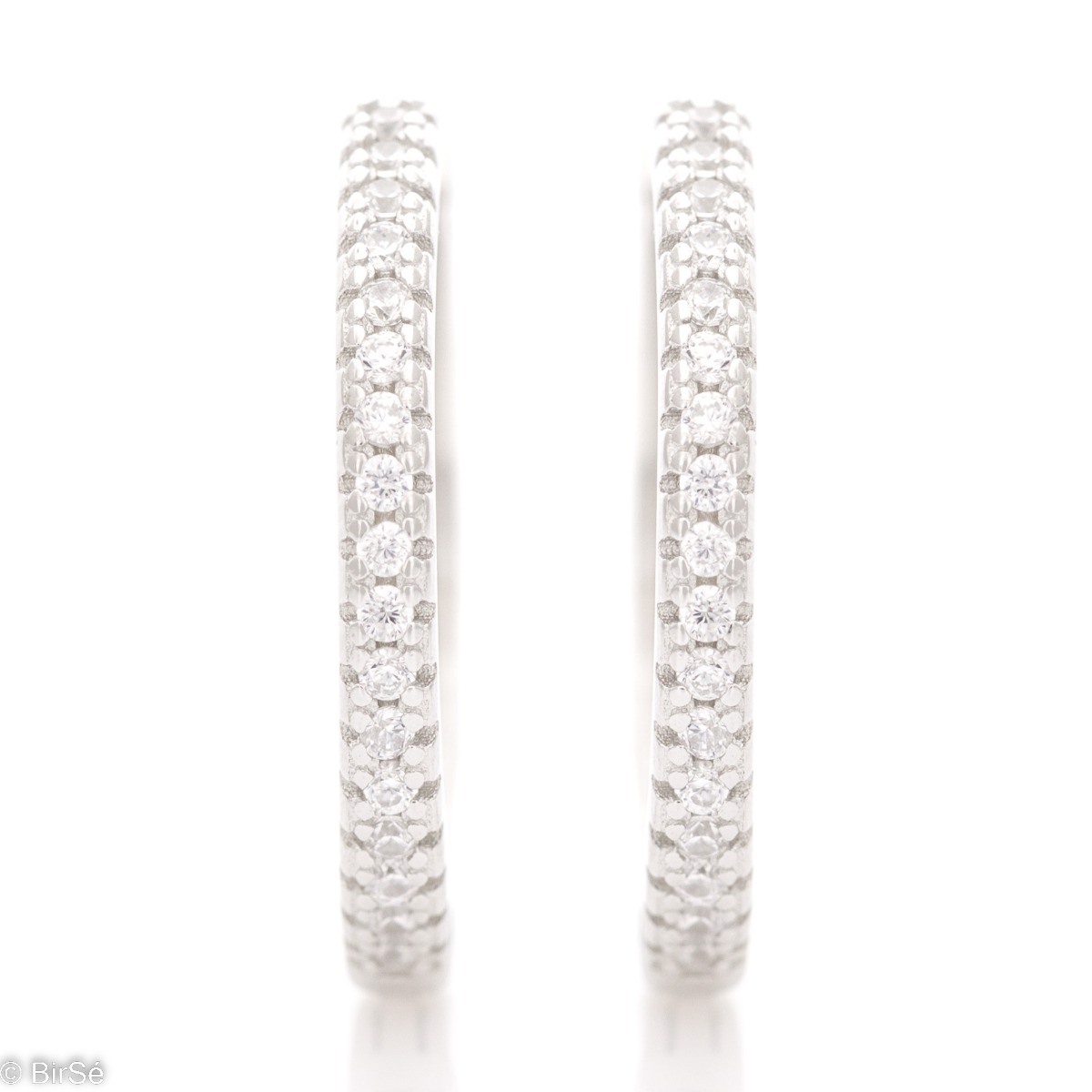 Spectacular women's earrings made of rhodium silver delicate rings. The rings are fully embellished with dazzling zircons and the English clasp makes them extremely comfortable.