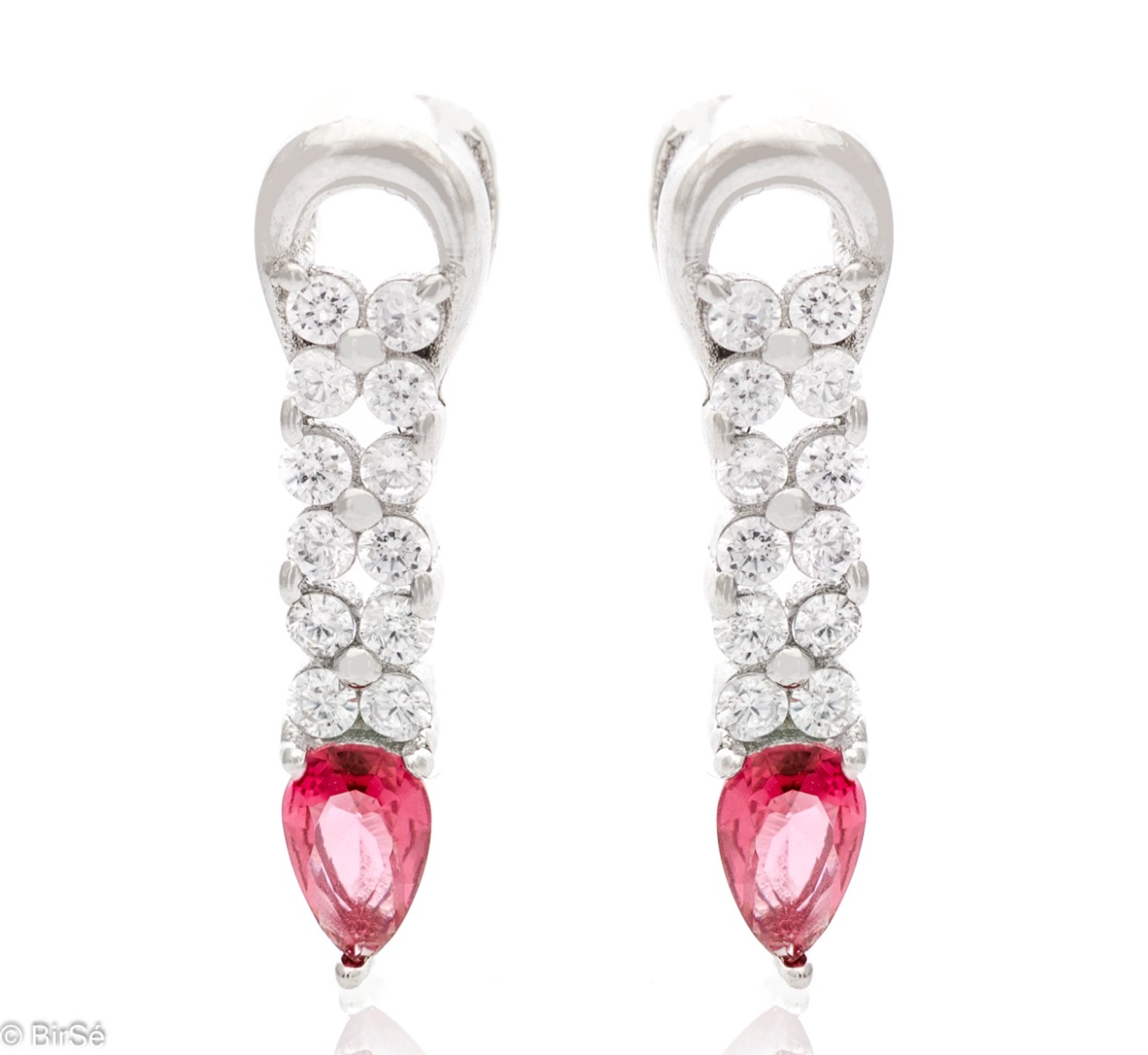 Elegant women's earrings made of soft rhodium-plated silver. A ruby-colored drop zircon is the main accent in the jewelry, in the company of more sparkling zircons. Pin fastening is convenient and practical.