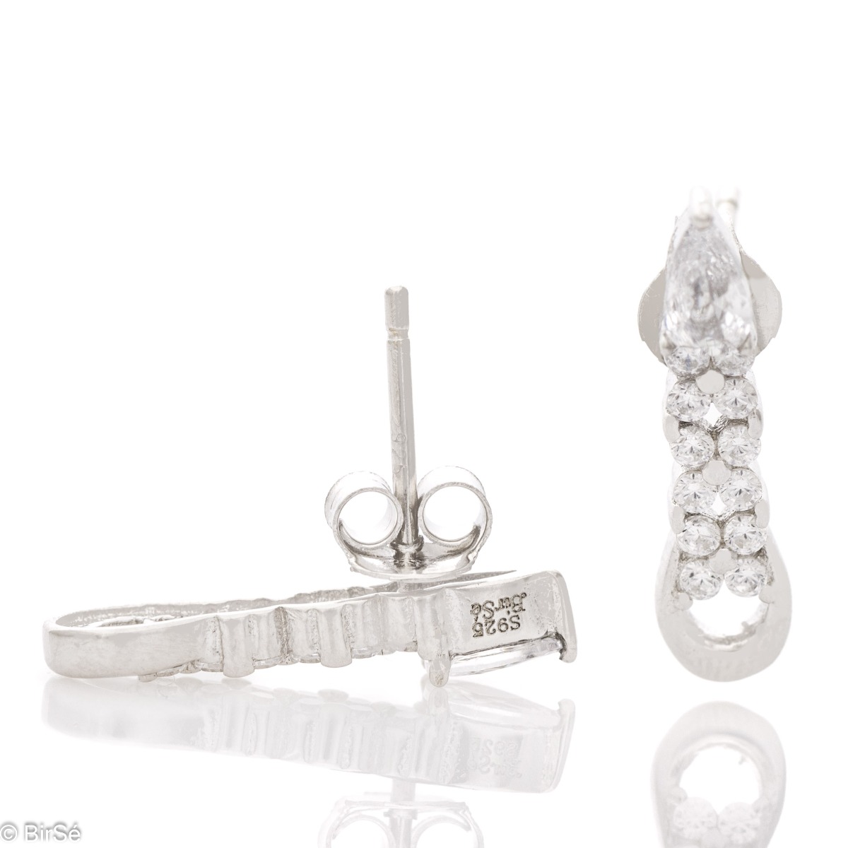 Elegant women's earrings made of soft rhodium-plated silver. The main accent in the jewelry is several glittering zircons. Fastening with a pin is convenient and practical, they are suitable for your everyday life.