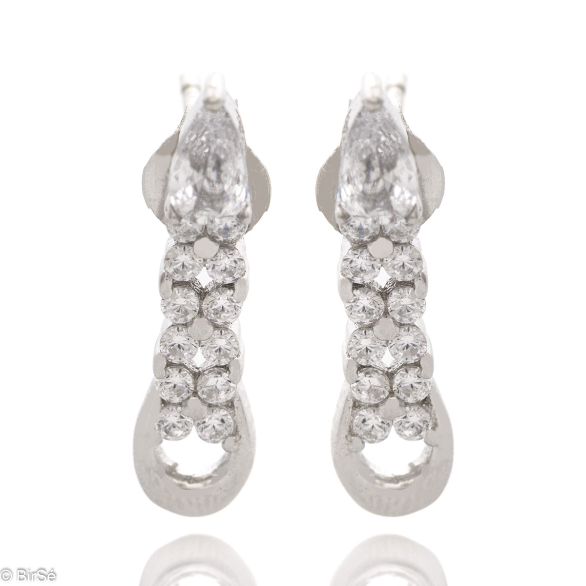 Elegant women's earrings made of soft rhodium-plated silver. The main accent in the jewelry is several glittering zircons. Fastening with a pin is convenient and practical, they are suitable for your everyday life.