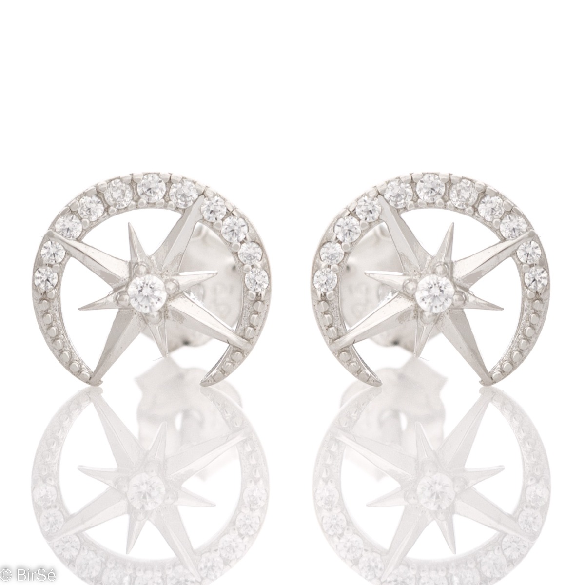 Shiny women's earrings, with a complete rhodium-plated silver finish and the subtle presence of delicate zircons. The earrings are fastened with a pin - comfortable and practical for your everyday life.