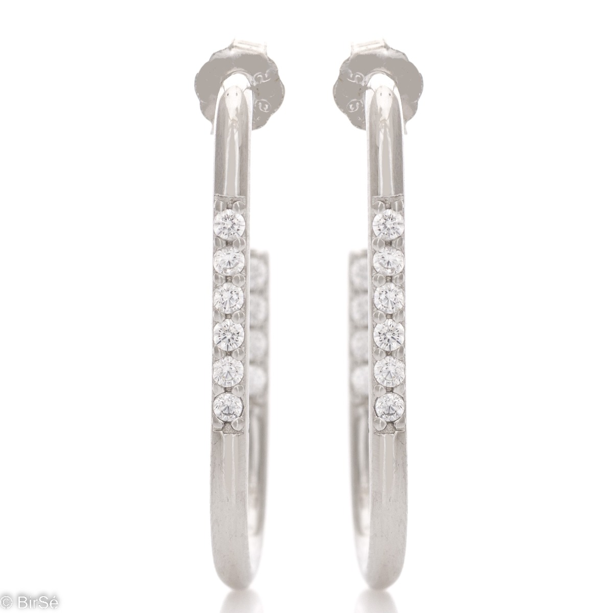 Stylish earrings in rhodium-plated silver with a half-ring shape and pin fastening. An elegant model, elegantly decorated with zircons. The earrings are suitable for your everyday life in the office or in nature.