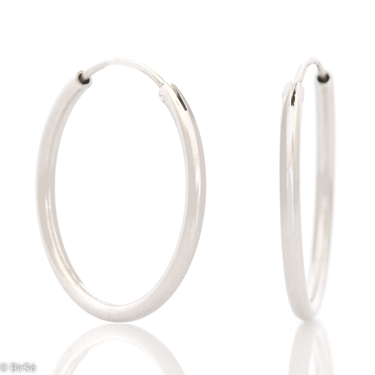 Classic design of women's earrings - rings of elegant rhodium-plated silver. The earrings are comfortable and practical for everyday use with an English clasp.