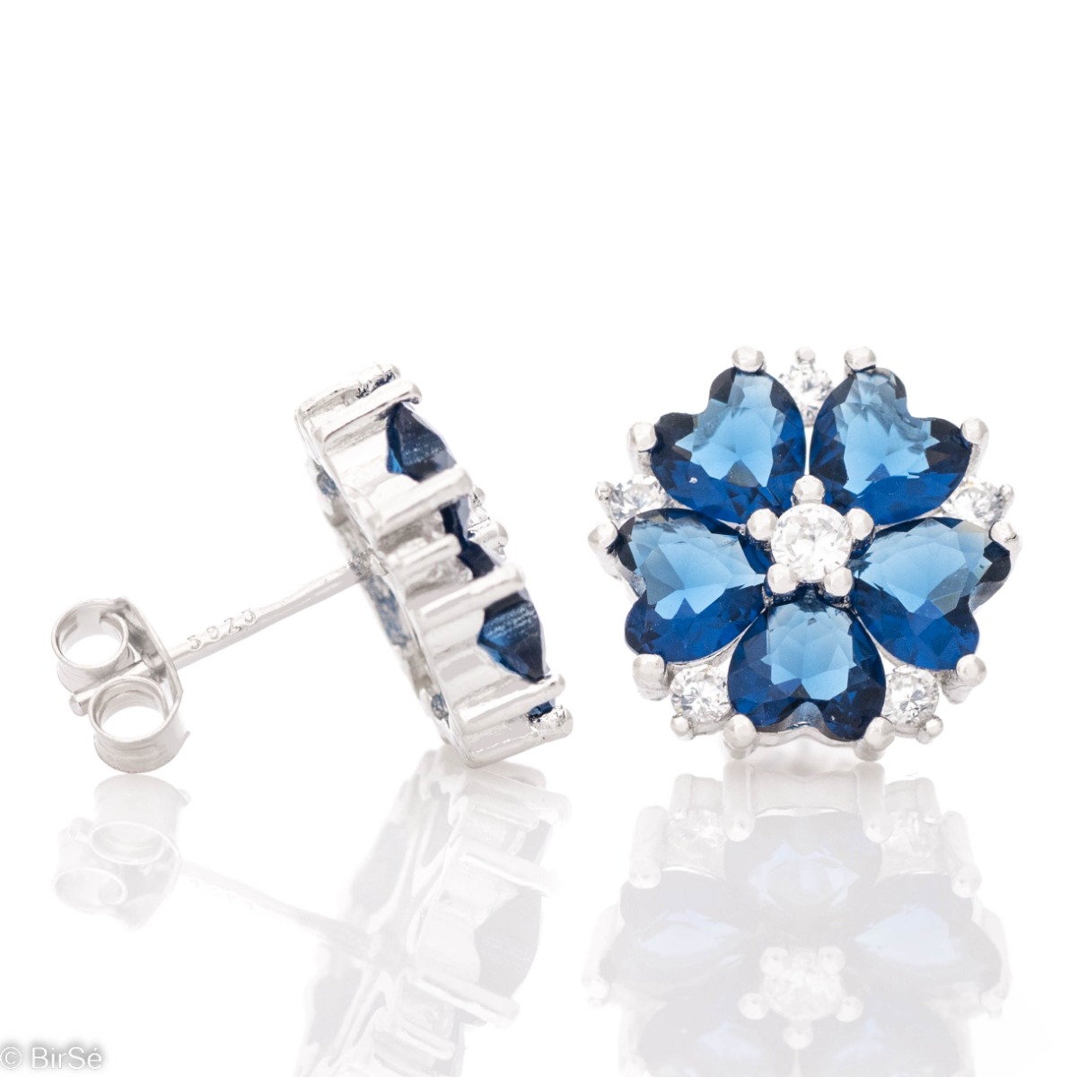 Captivating sterling silver earrings with an exquisitely crafted flower in fine rhodium silver and colored zircons. A suitable gift to charm your favorite girl.