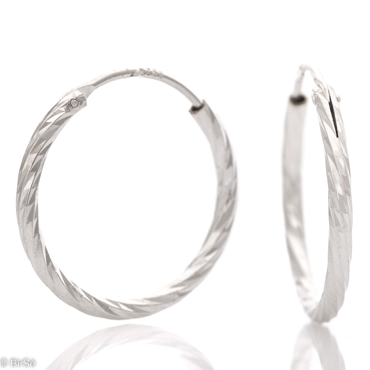 Exquisite workmanship of women's earrings - rings of elegant rhodium-plated silver with a diamond effect. The earrings are comfortable and practical for everyday use with an English clasp.