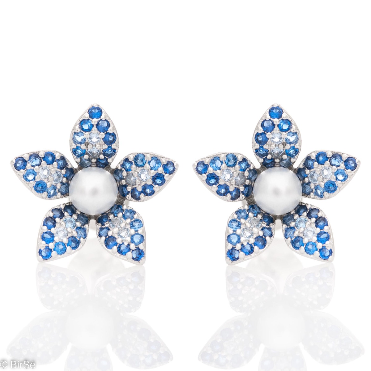 Charming women's earrings, made entirely of rhodium-plated silver with a beautiful flower shape. Colorful blue zircons and a delicate pearl add charm to the earrings, which are suitable for ladies and children.