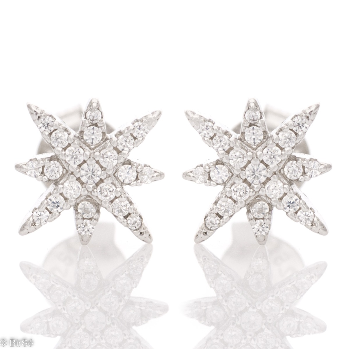 Extremely fine sterling silver stud earrings in the shape of stars, made entirely of shiny rhodium silver, complemented by zircons.